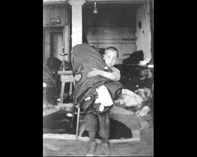 Lewis Hine: Boy Carrying Homework from New York Sweatshop
