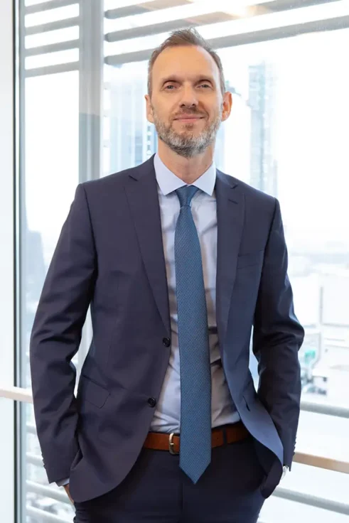 Founder portrait in SoHo loft — window background — NYC headshot photographer