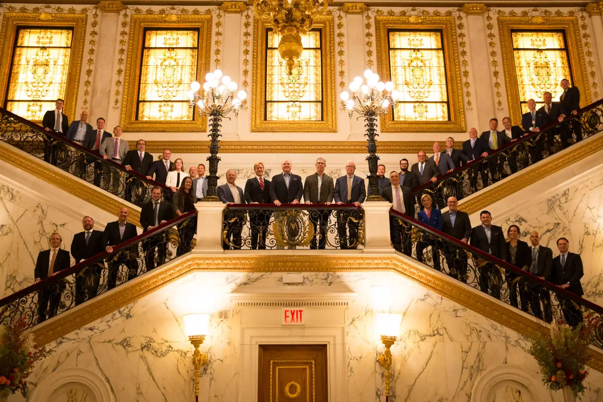 Board members group photo — museum-style backdrop — New York City executive portrait