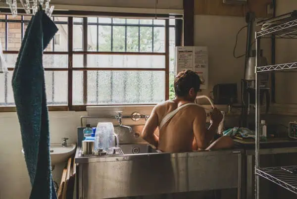 Taisuke Sato in bath for a collaboration project with James Maher typed Family Album