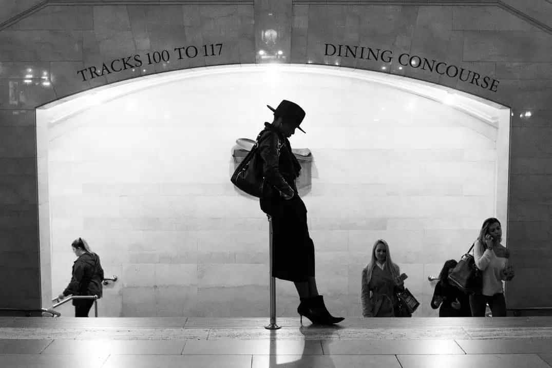 Black and white street photography of woman in grand central terminal