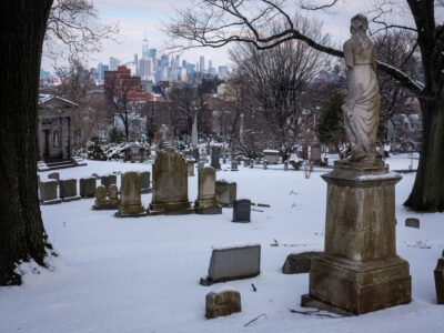 Gravestones and Freedom Tower, Greenwood Cemetery. 2019