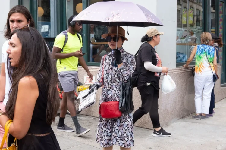 Canal Street Seller with Umbrella, 2019