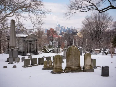 Gravestones and Freedom Tower (closeup), Greenwood Cemetery. 2019