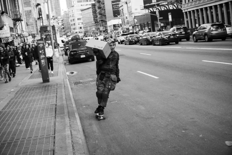 Delivery Man on Skateboard, Canal Street, 2022