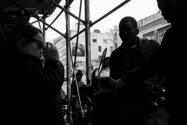Trying on Sunglasses, Canal Street, 2023